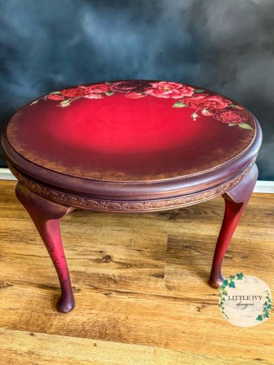 Oak coffee table with roses on deep red paint blend