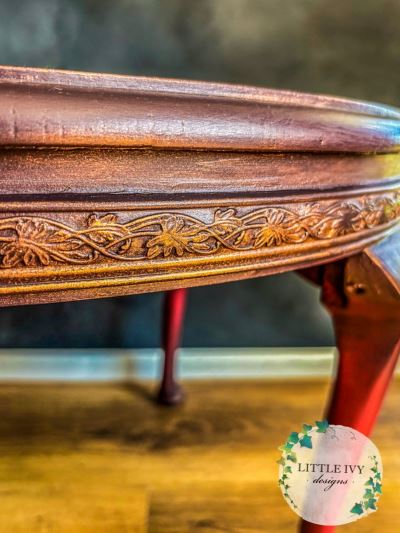 Oak coffee table with roses on deep red paint blend