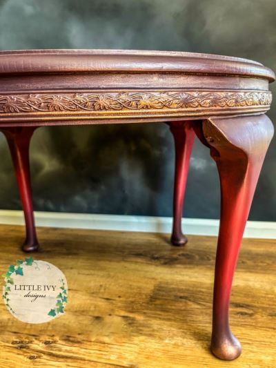 Oak coffee table with roses on deep red paint blend