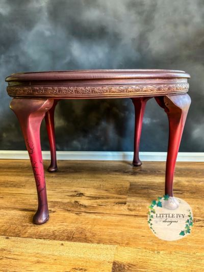 Oak coffee table with roses on deep red paint blend