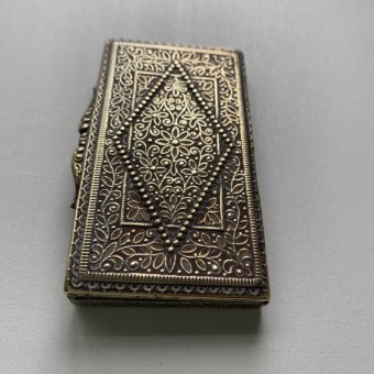 Anglo-Indian cigarette box with intricate raised design 