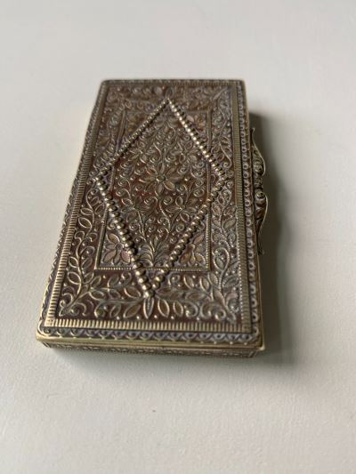 Anglo-Indian cigarette box with intricate raised design 